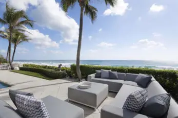 a patio with a couch and a table
